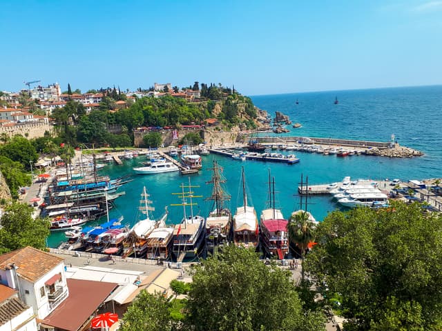 Antalya's old harbor below Kaleiçi, with wooden boats and turquoise water