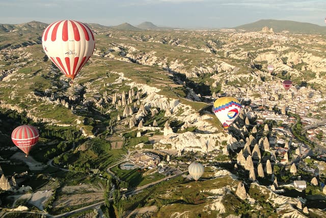 Hot air balloons over the rock formations and fairy chimneys around Göreme